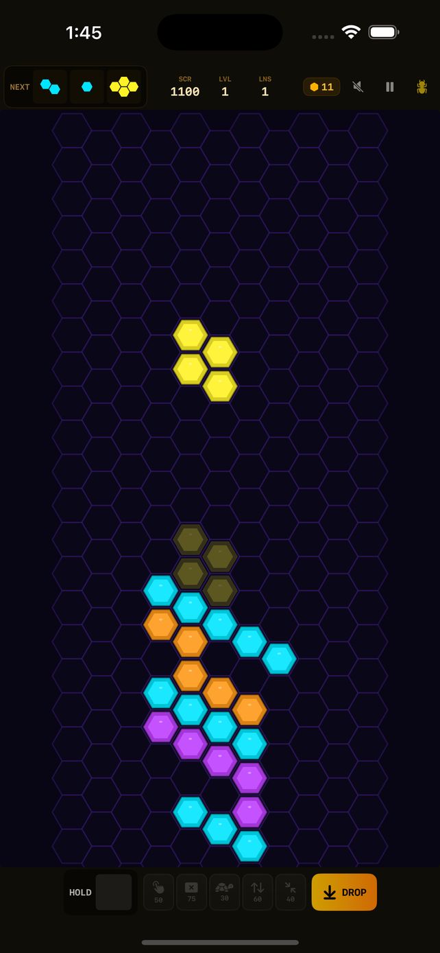 UltraHive gameplay with a falling yellow hex piece, ghost preview, and colorful stacked honeycomb